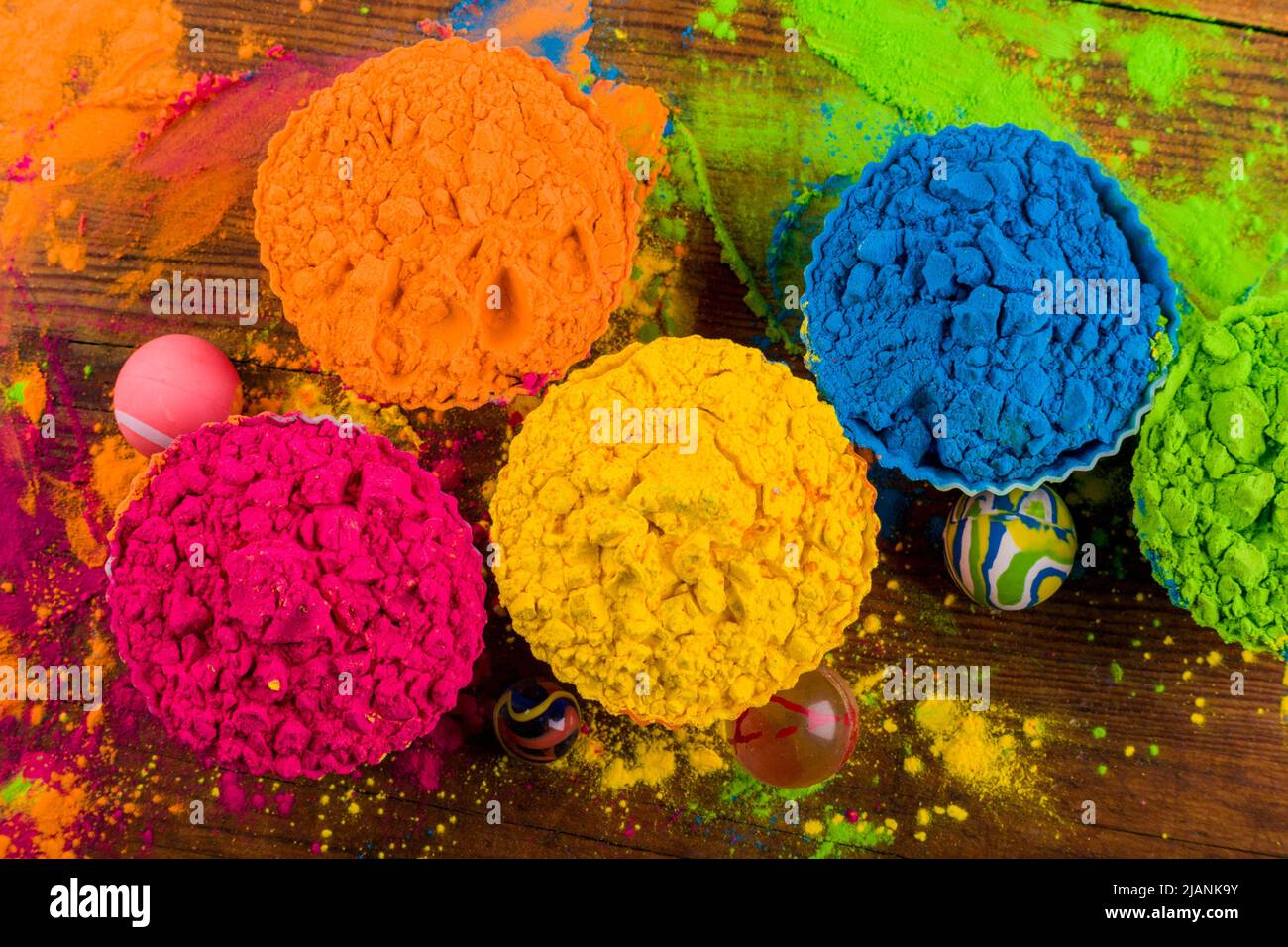 Assorted bright podwer color samples on dark background Stock Photo