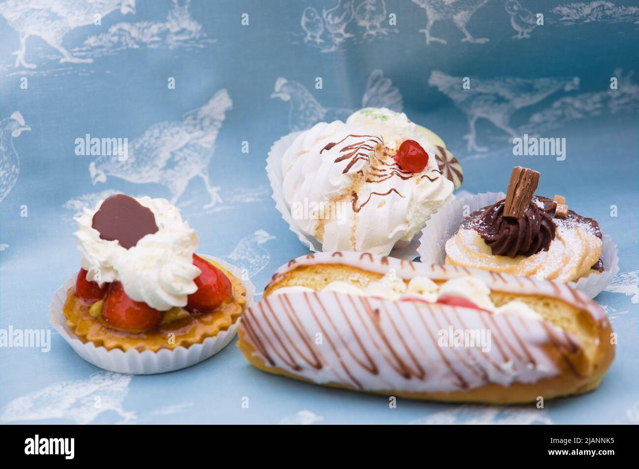 Closeup of a selection of fresh cream cakes from Cosson's Bakery and
