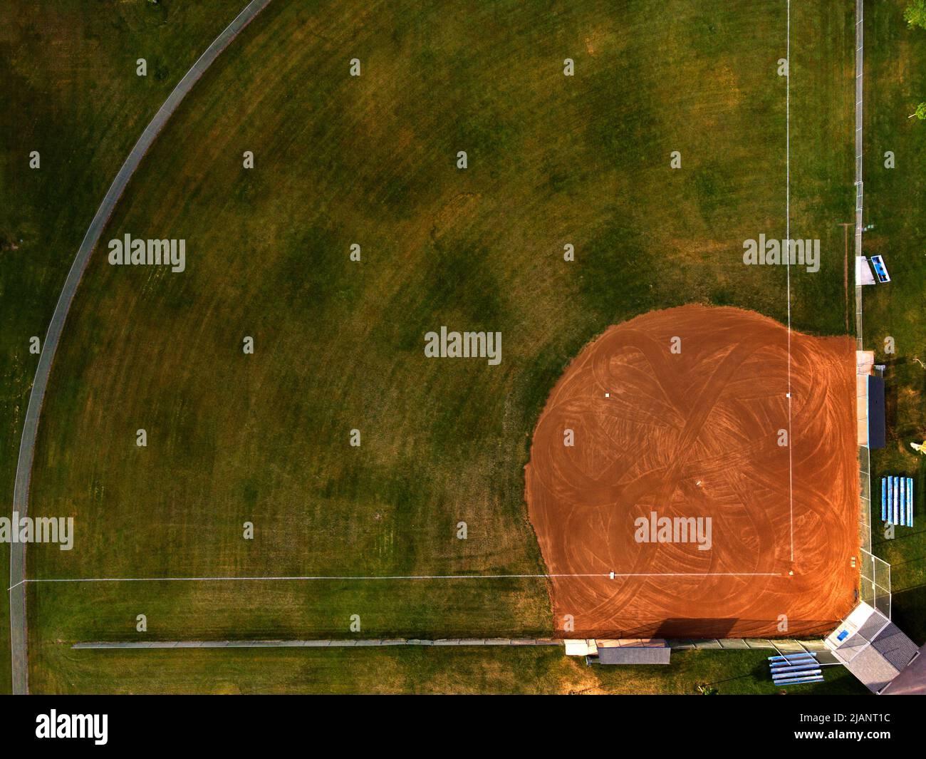 Aerial view from a drone flying above an outdoor urban baseball field