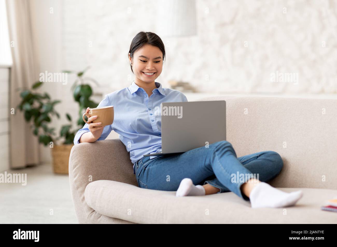 Happy asian young woman hi-res stock photography and images - Alamy