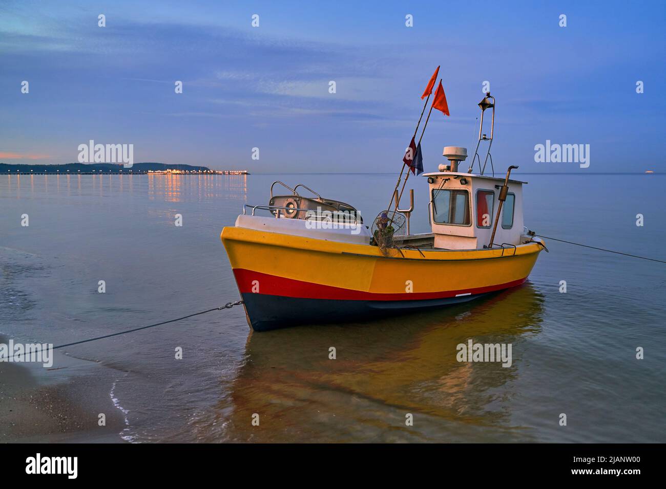 Picturesque moored fishing boat on beach in Sopot, Pomorskie region, Poland Stock Photo