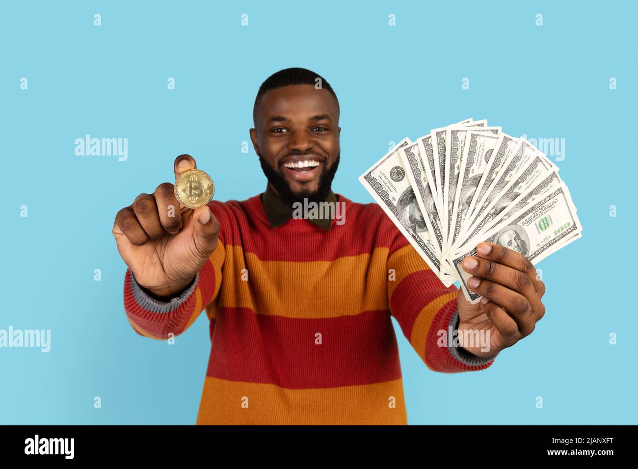 Crypto Trading. Excited Black Man Holding Golden Bitcoin Coin And Dollar  Cash Stock Photo - Alamy