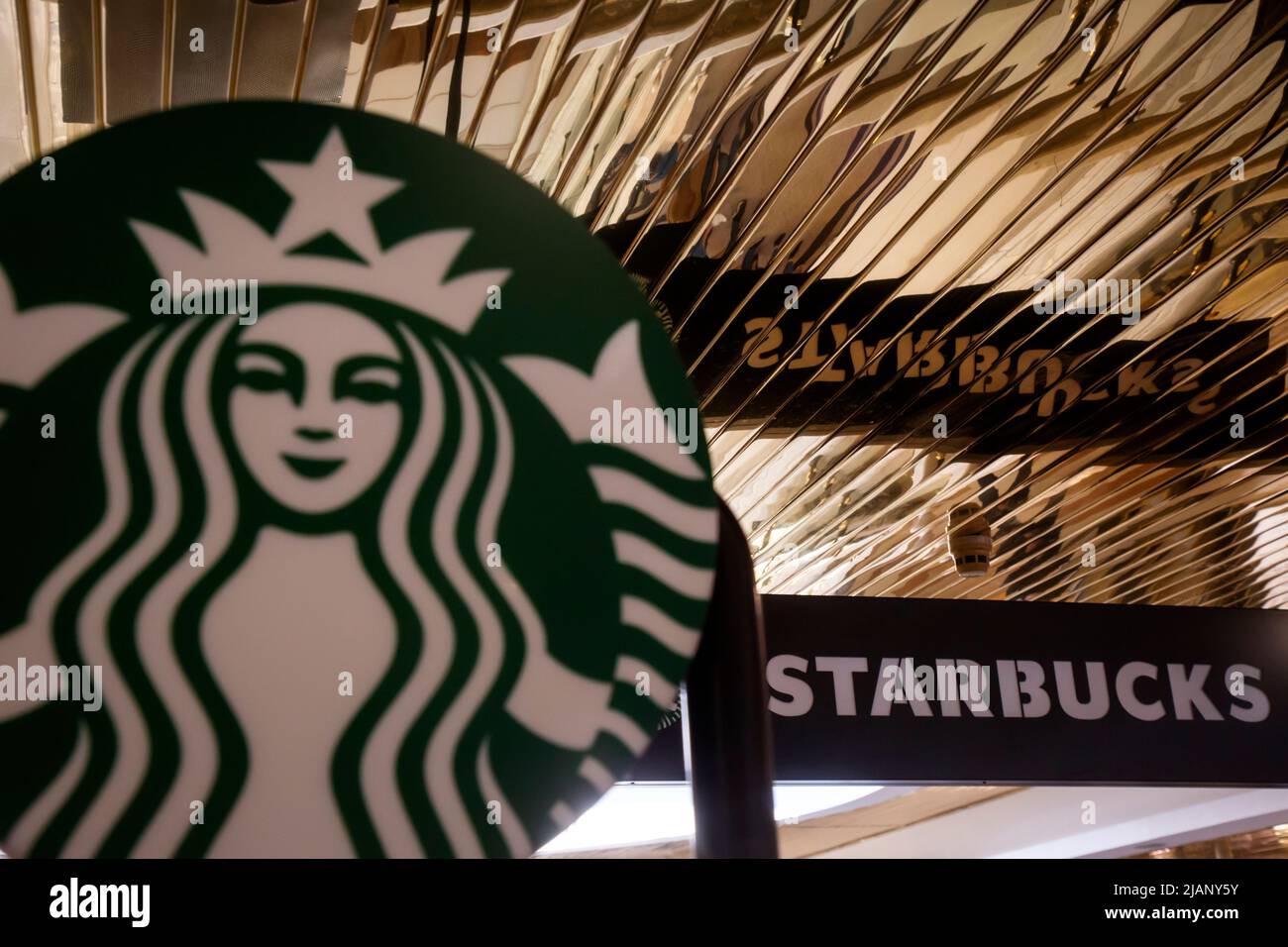 Advertising of the Starbucks coffee chain in a shopping mall Stock Photo
