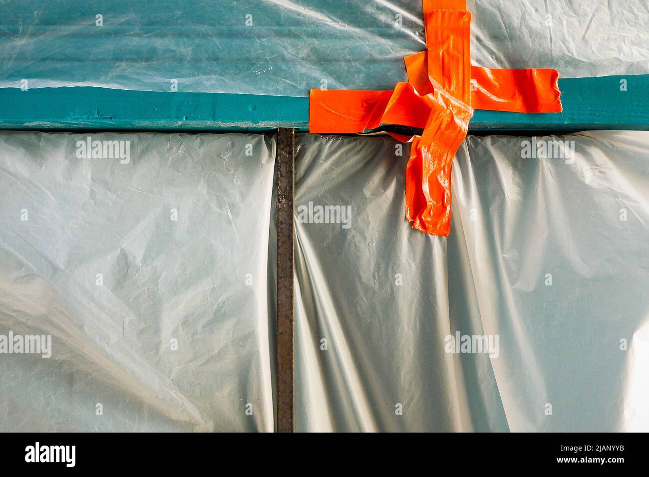 A plastic tarpaulin protects an under renovation shop, Croix-Rousse district, Lyon, Auvergne Rhone-Alps region, Central-Eastern France Stock Photo