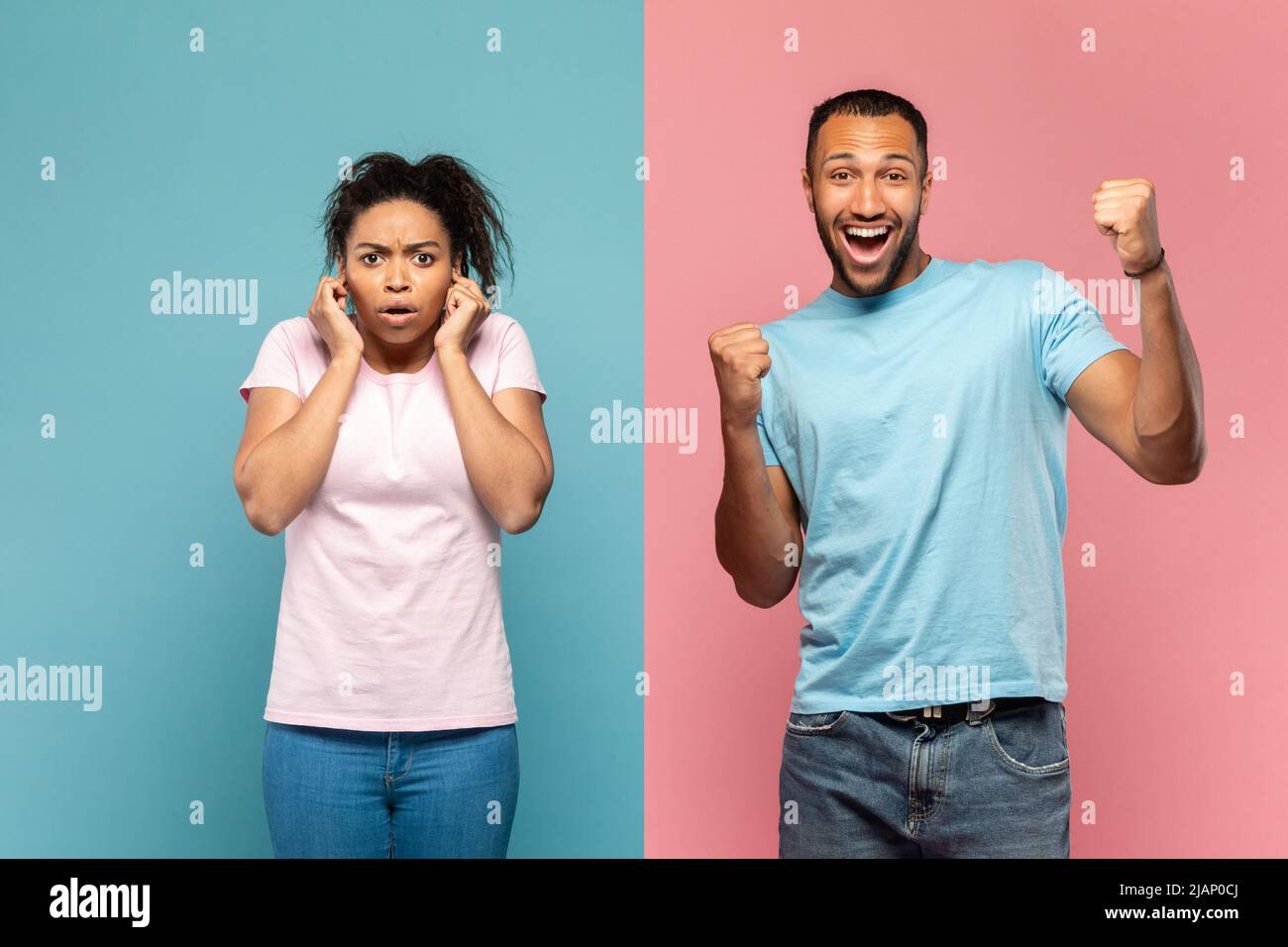 Happy young black man shouting loud, celebrating victory, scared woman closing her ears with fingers, shocked with noise Stock Photo
