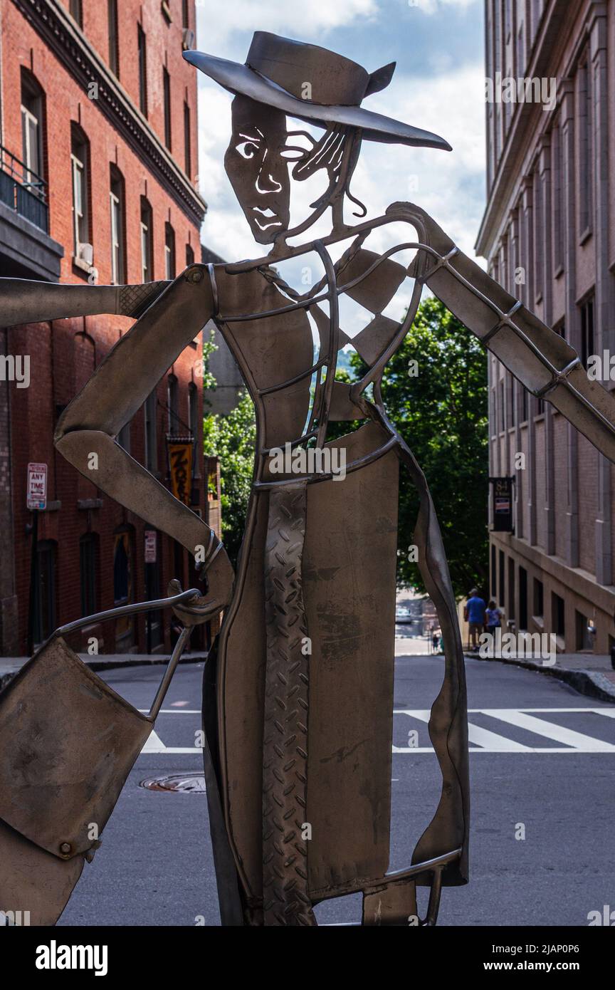 This forged-metal sculpture on the urban trail, 'Shopping Daze,' pays homage to Asheville NC's past and present as a distinctive shopping district. Stock Photo