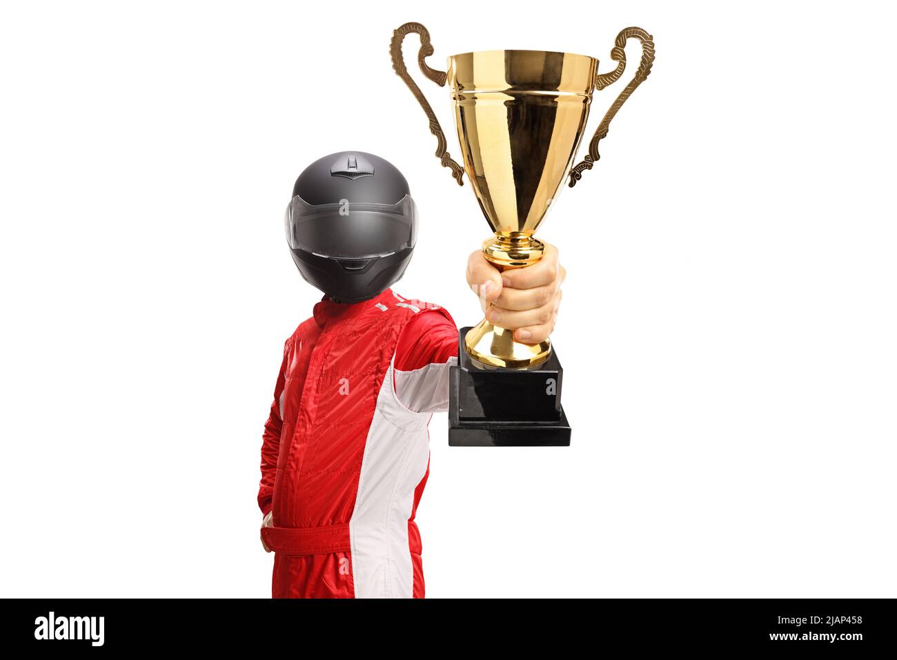 Racer holding a gold trophy cup and wearing a black helmet isolated on white background Stock Photo
