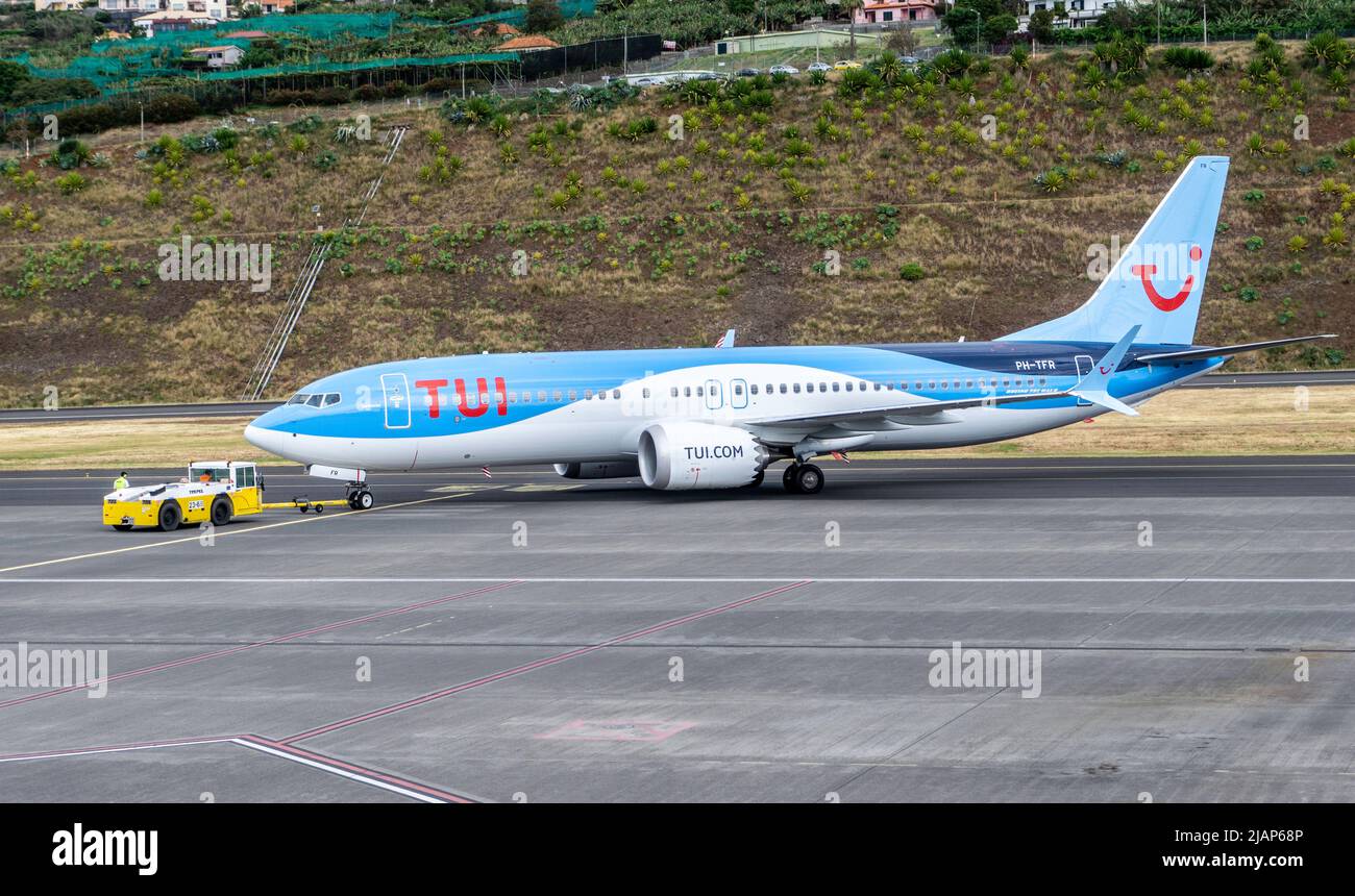 A TUI plane preparing for take off in Madeira International Airport. Stock Photo