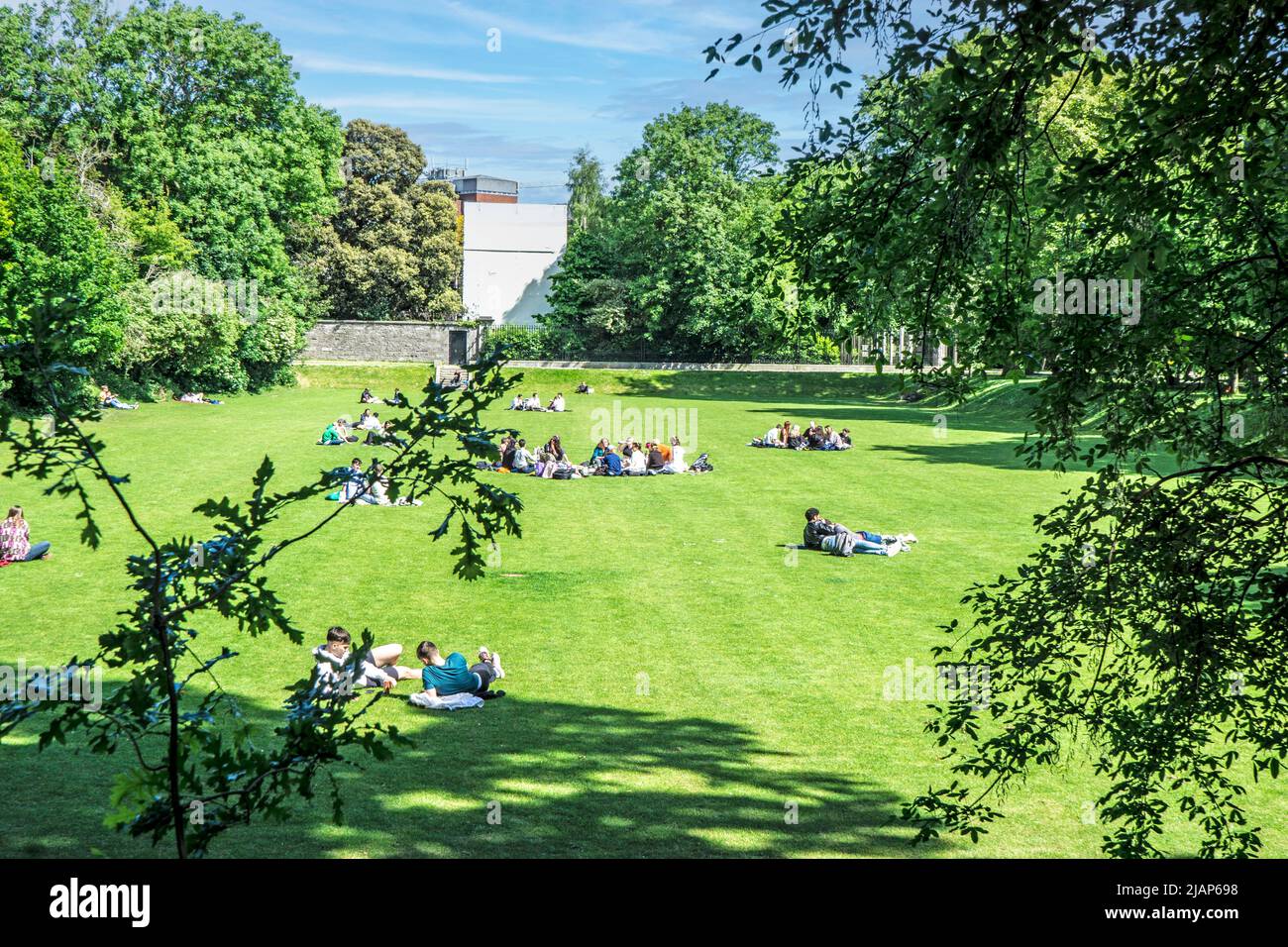 People enjoying the sunshine in Iveagh Gardens, Dublin, Ireland. Stock Photo