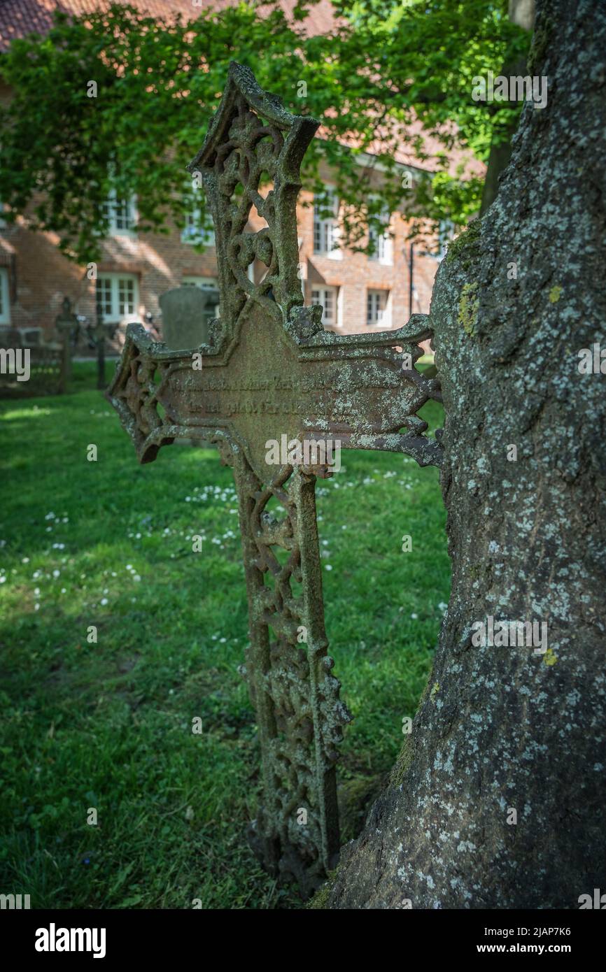 historic cast iron cross on a graveyard Stock Photo