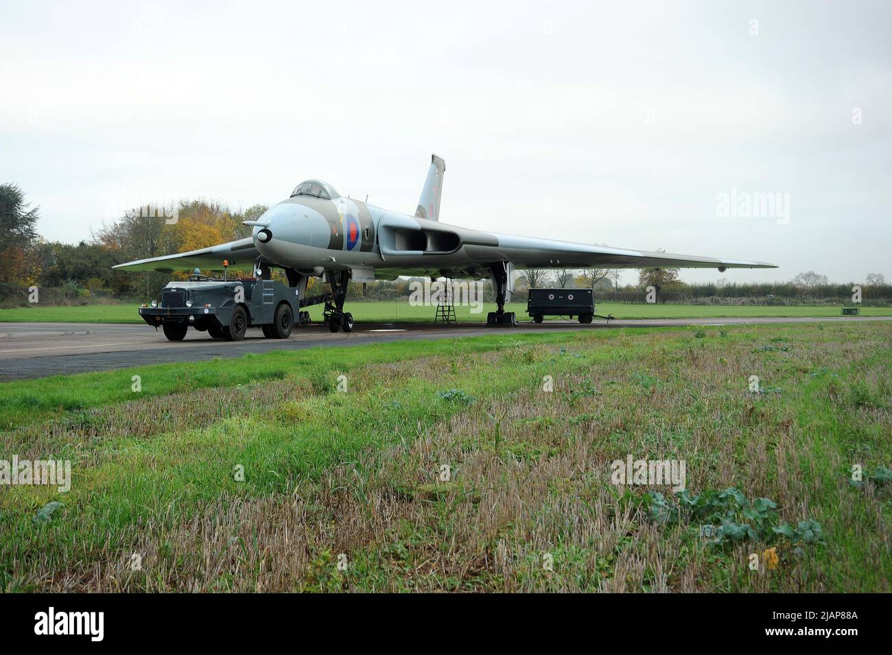 XM655 and Aircraft Tug at Wellesbourne Airfield. Stock Photo