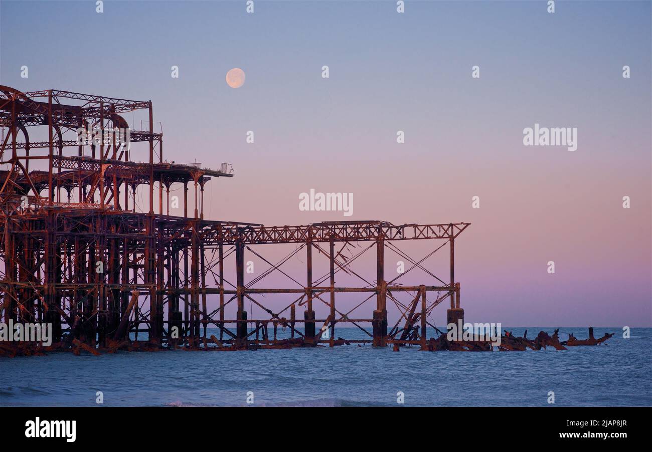 Detail of the rusting remains of the dilapidated West Pier at dawn low tide. Brighton & Hove