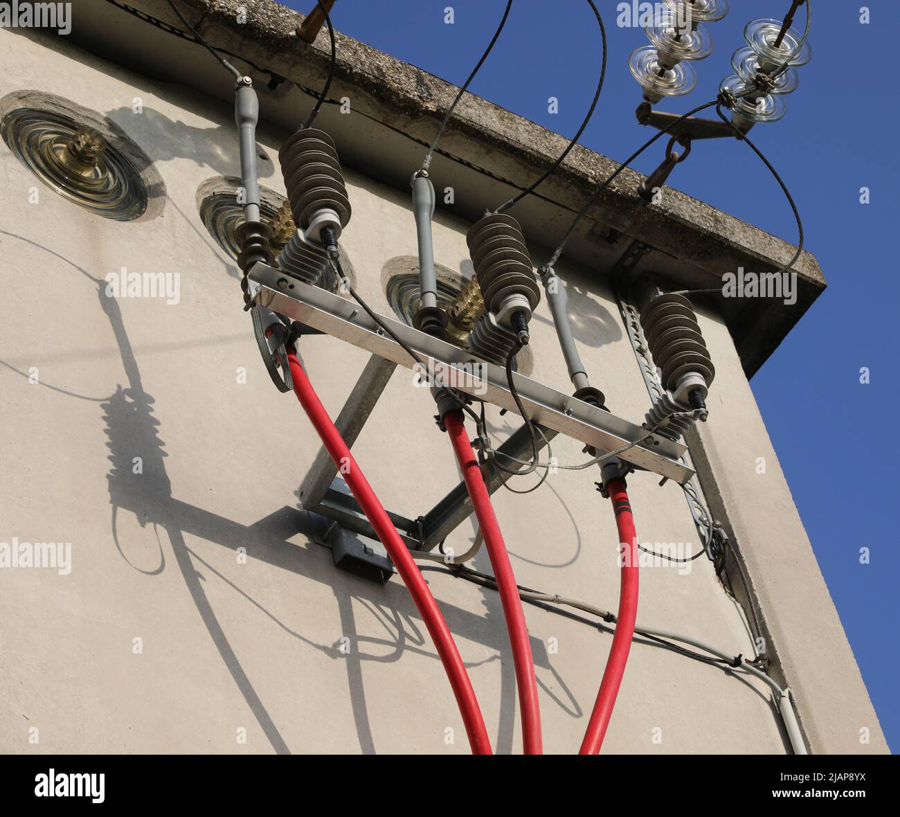 detail of the high voltage electrical red isolated cables in the ...