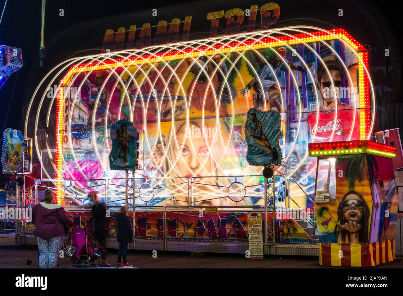 Long exposure of a fairground ride 'Miami Trip' at Seaburn Funfair, Sunderland, UK in October 2016 Stock Photo