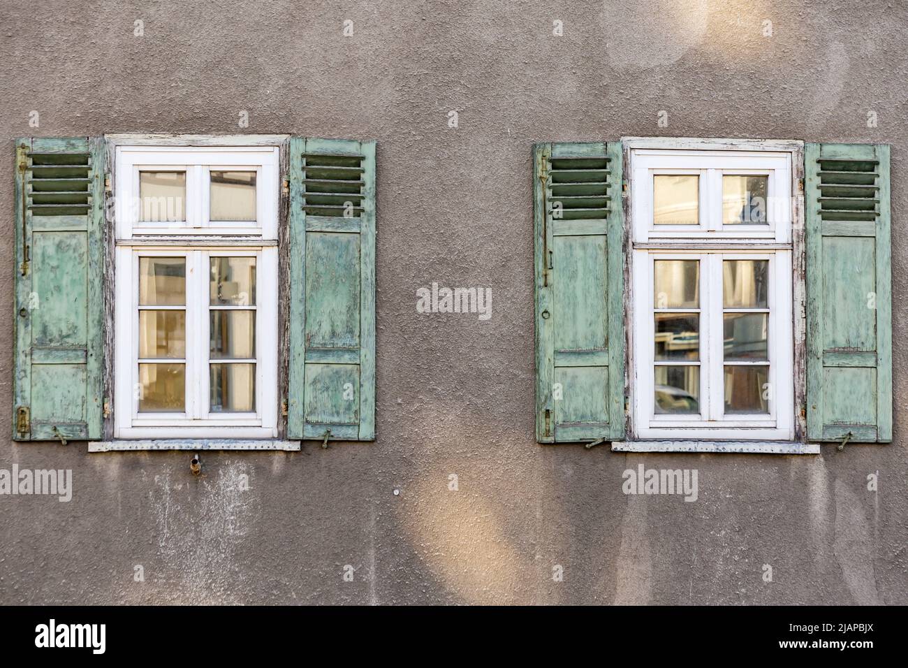Old House Facade with green wooden folding shutters in detail Stock ...