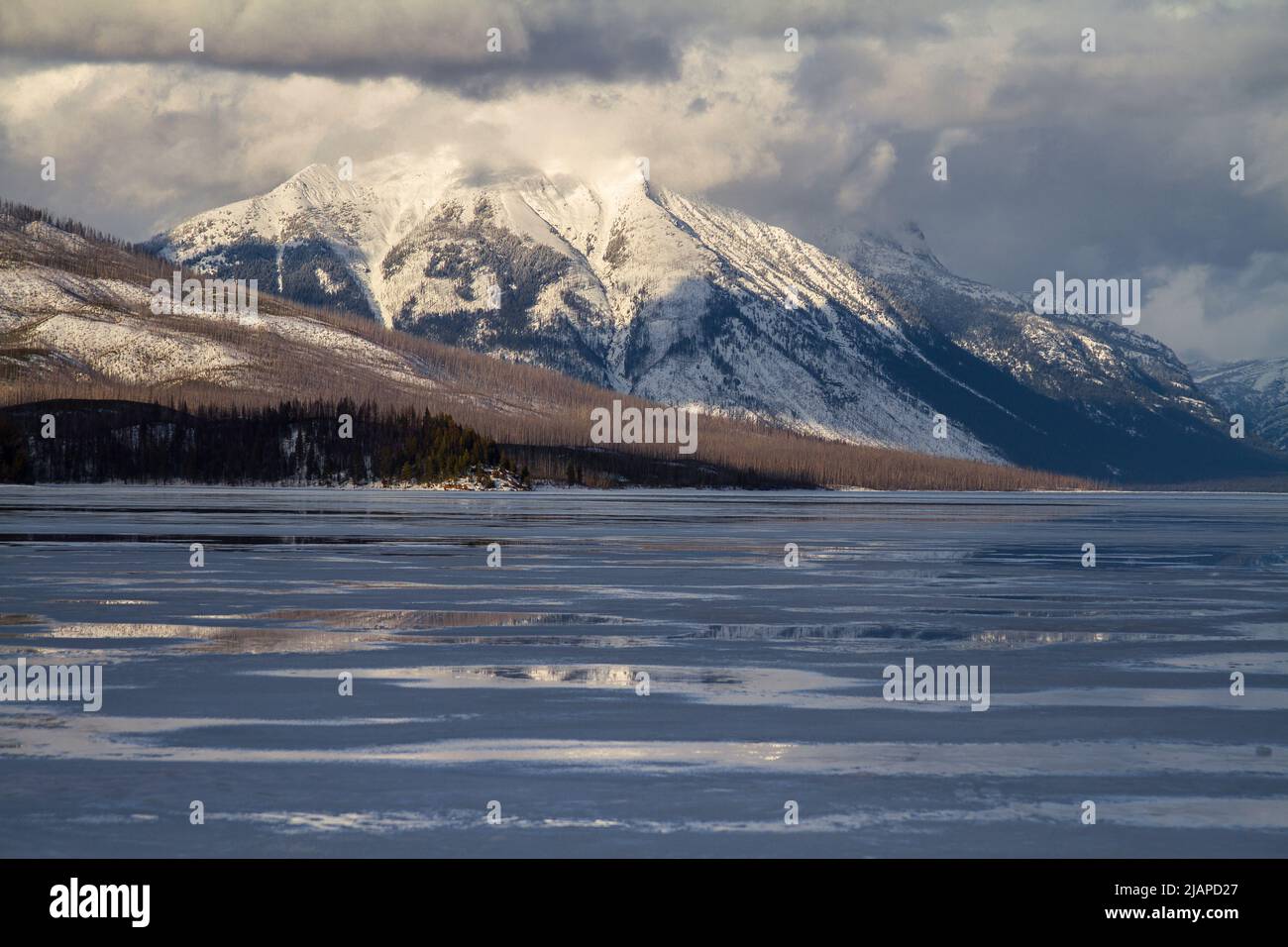 Stanton Mountain and frozen Lake McDonald in Glacier National Park, Montana, United States of America.  An optimised version of a US National Park Service. Photo credit: NPS/D.Restivo Stock Photo