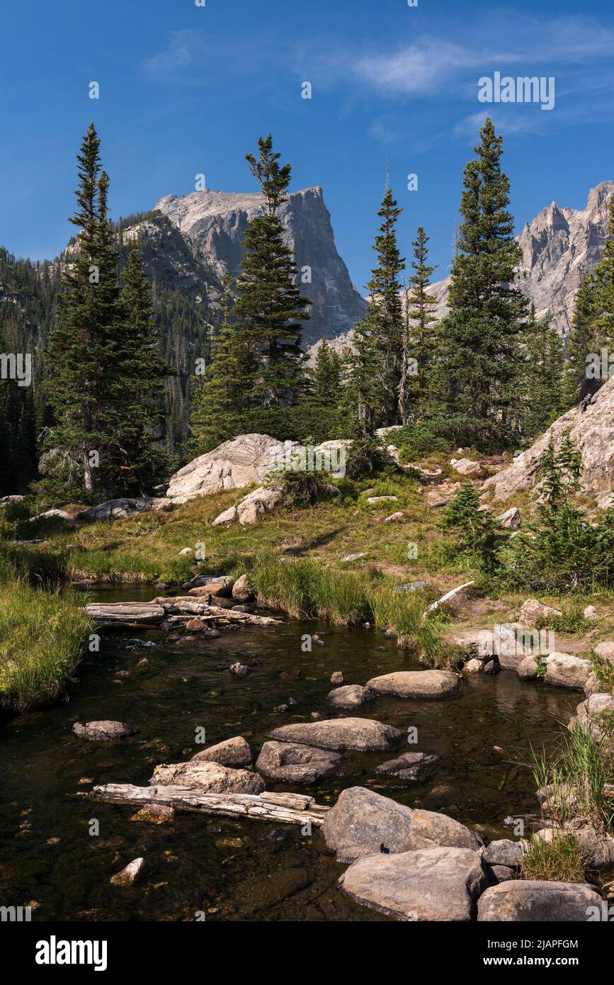 A Stream Flows from Dream Lake with Backdrop of High Peaks along the Continental Divide in Colorado. Stock Photo