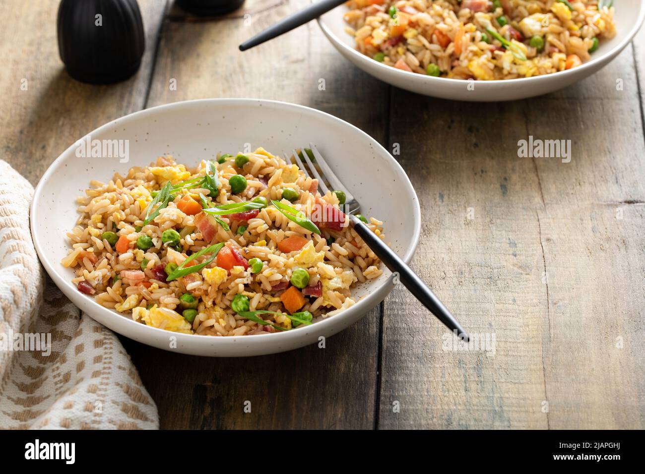 Breakfast fried rice with bacon and scrambled eggs Stock Photo