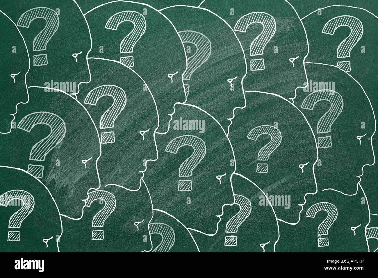 Human faces with question marks inside. Illustration on greenboard. Stock Photo