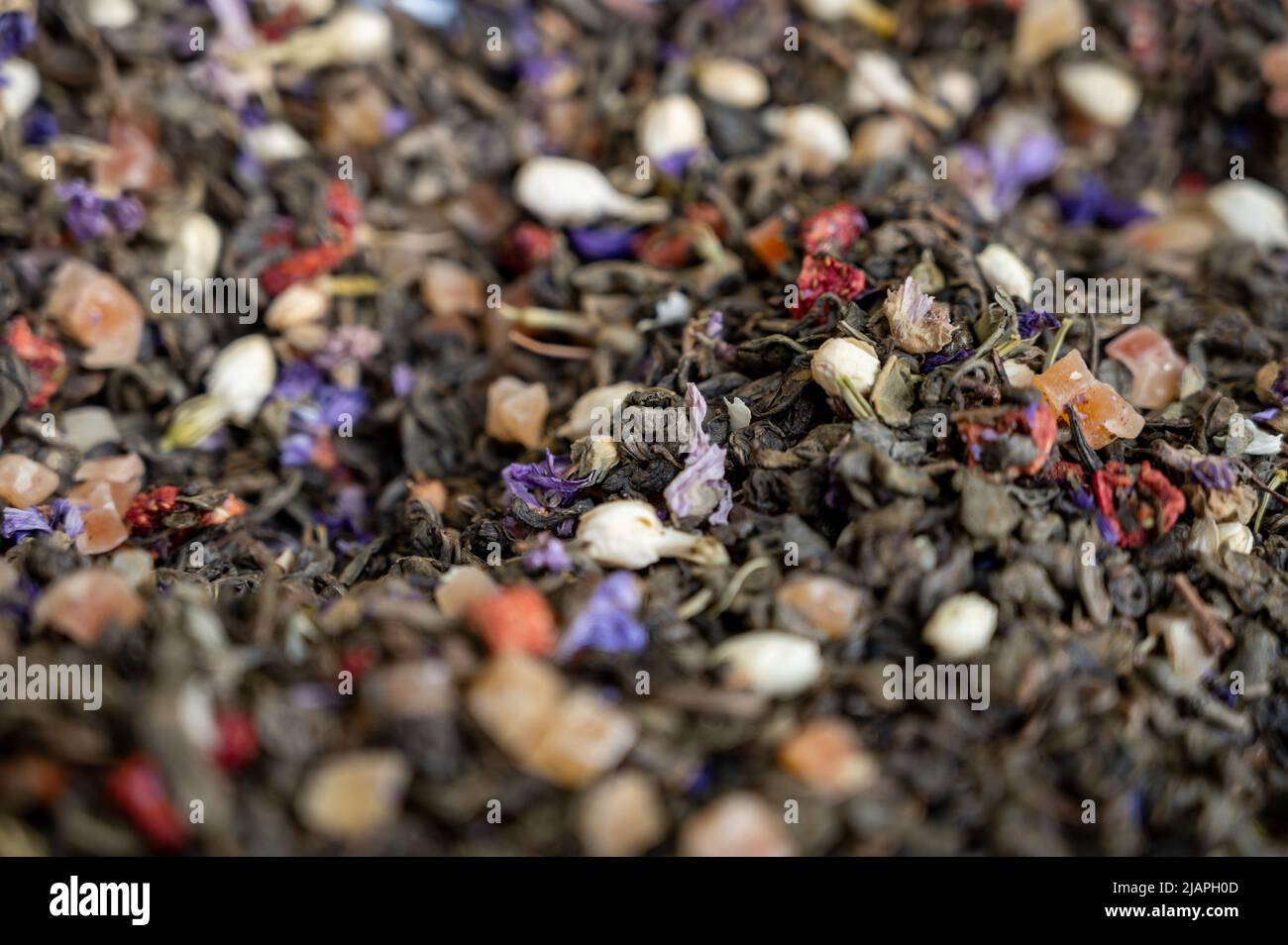 Blended black leaf dry tea with aromatic flowers, spices in tea shop in Granada, Andalusia