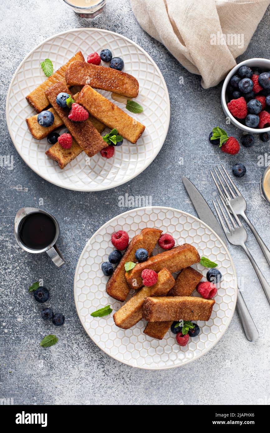 French toast sticks with maple syrup and berries Stock Photo - Alamy
