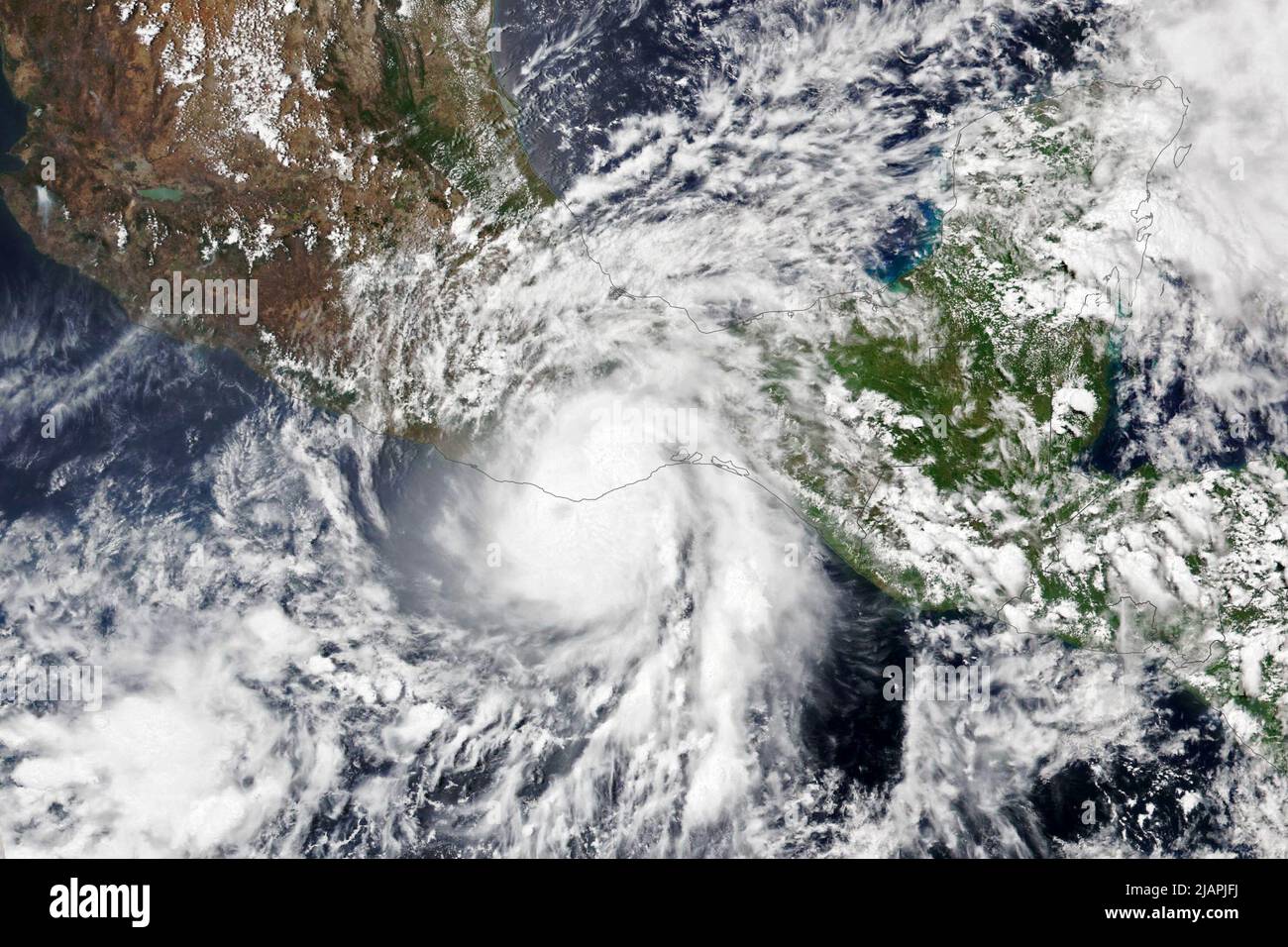 Puerto Escondido, Mexico. 31st May, 2022. In a handout photo from the NASA Earth Observatory, Hurricane Agatha struikes the western coast of Mexico on May 30, 2022, near Puerto Escondido. After making landfall Monday afternoon as a Category 2 hurricane just west of Puerto Angel, Mexico, Agatha has weakened and is now just a low-pressure system, according to the National Hurricane Center. (Credit Image: © NASA Earth Observatory images/ZUMA Press Wire Service) Stock Photo