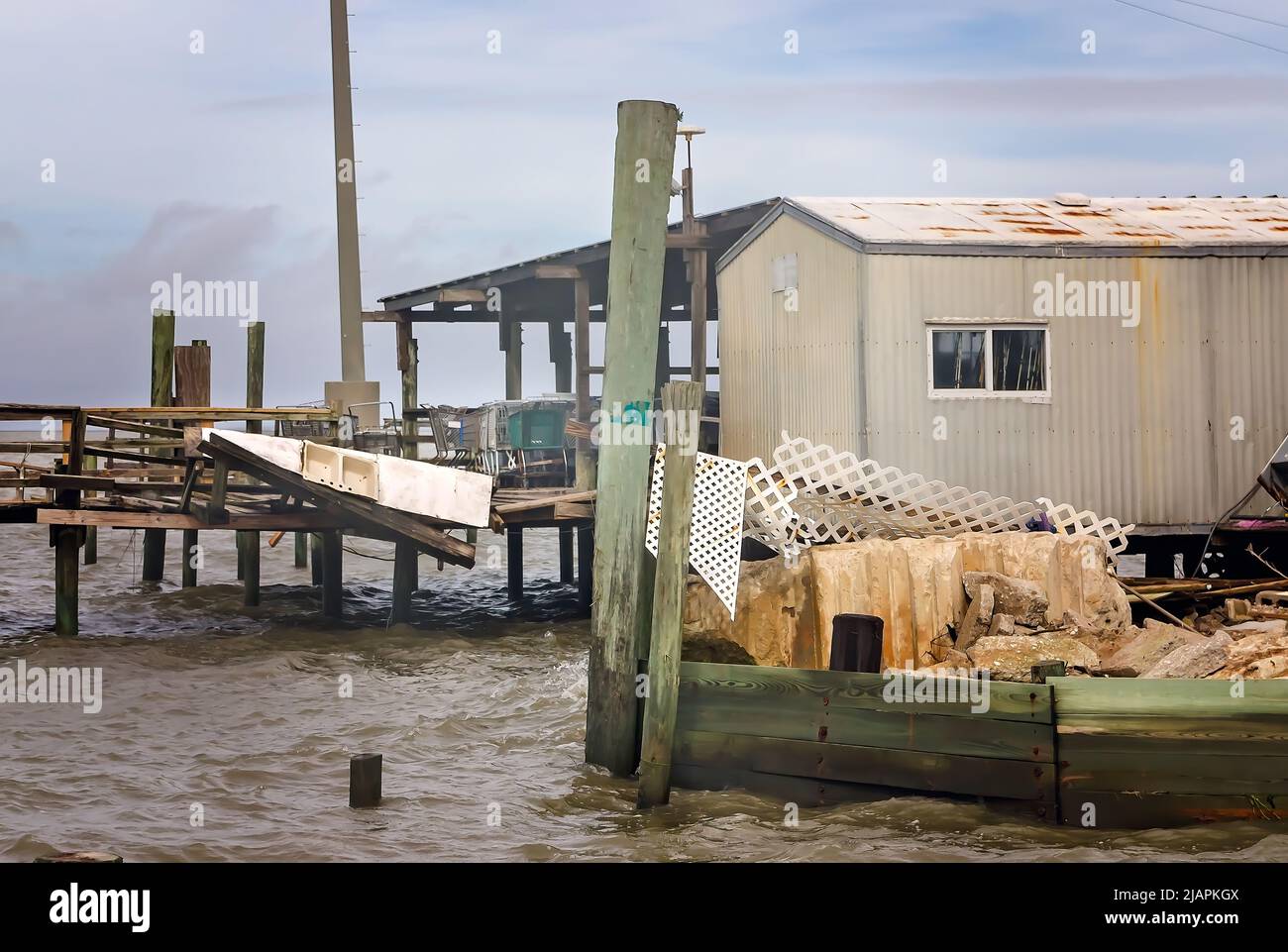 The Cedar Point fishing pier lays in shambles after Hurricane Nate, Oct. 8, 2017, in Coden, Alabama. Stock Photo