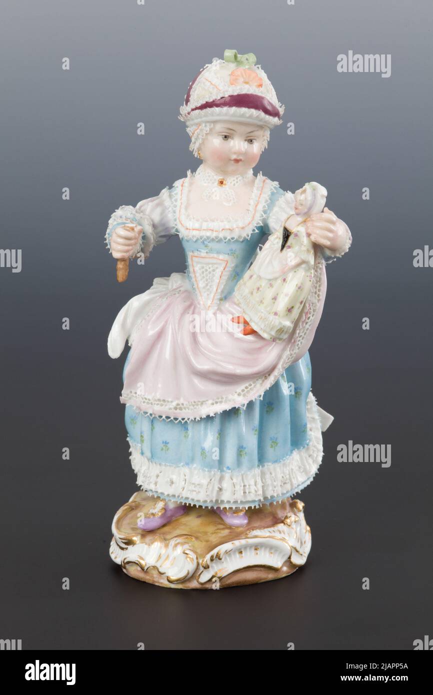 A girl with a doll Mi Nia (Meissen) Stock Photo