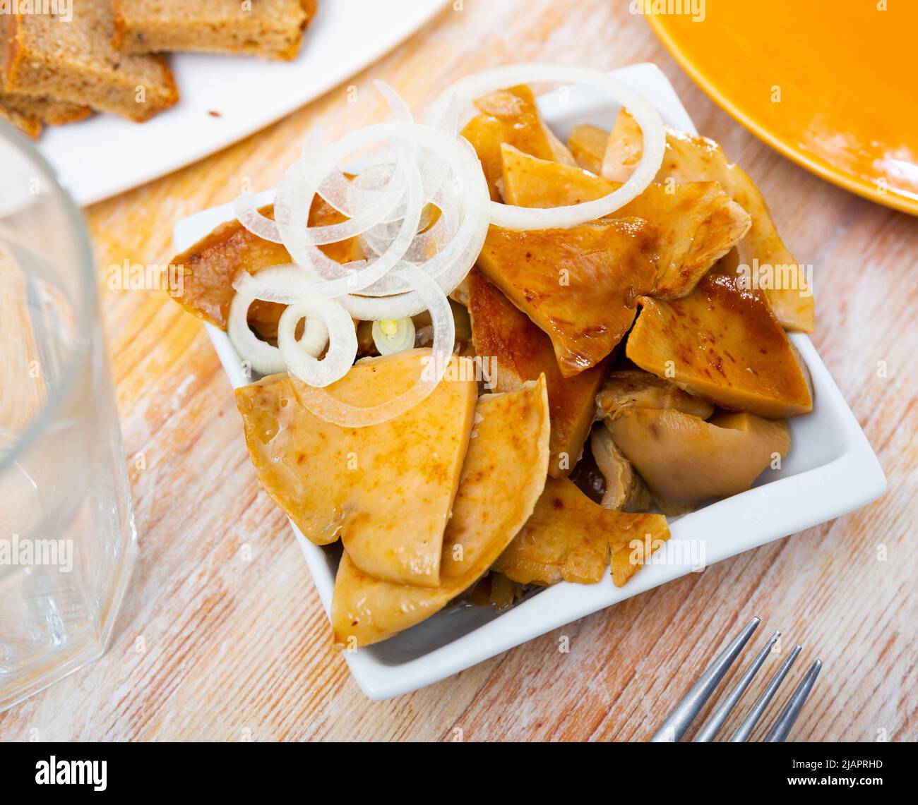 Pickled russula delica with onions Stock Photo