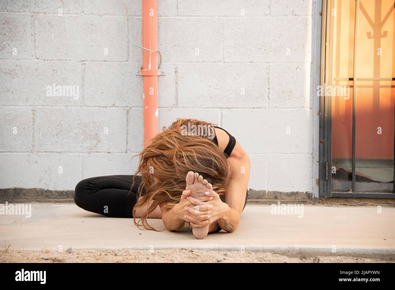 Yoga in a small desert town in California. Stock Photo