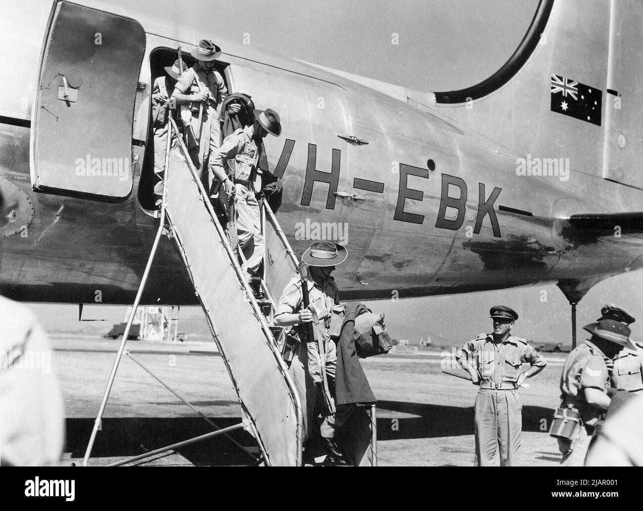Australian soldiers deplane a Qantas Empire Airways Douglas DC-4 (VH ...