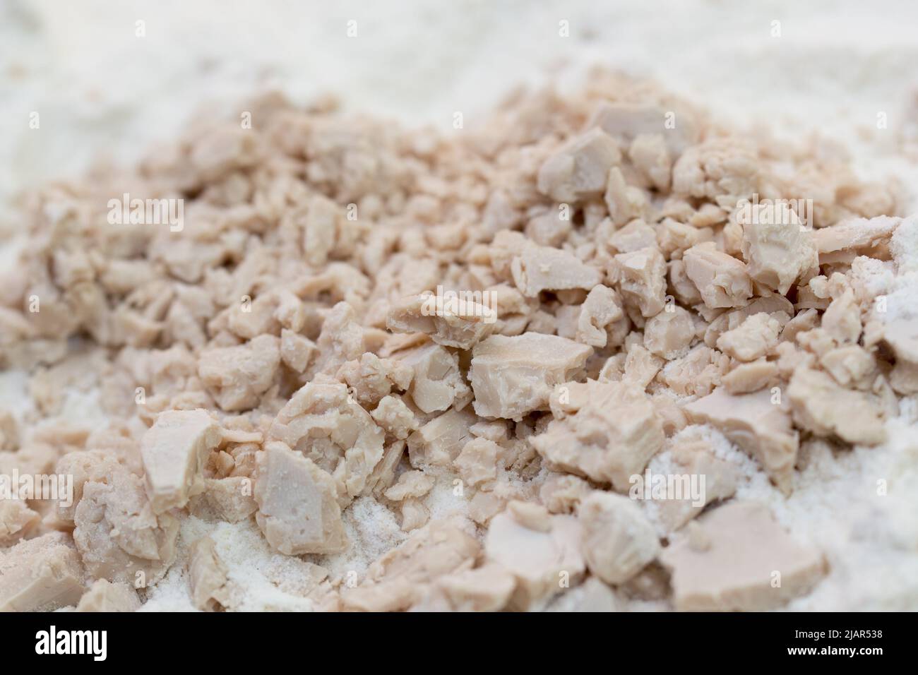 fresh raw yeast and flour closeup selective focus Stock Photo