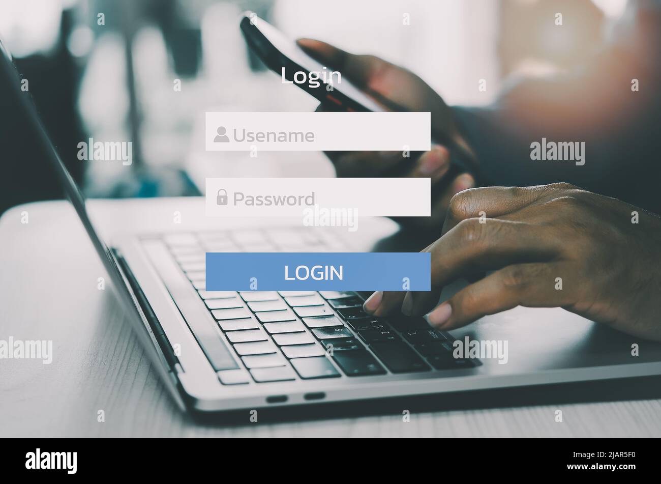 man using laptop computer and sign up or log in username password virtual touch screen. Stock Photo
