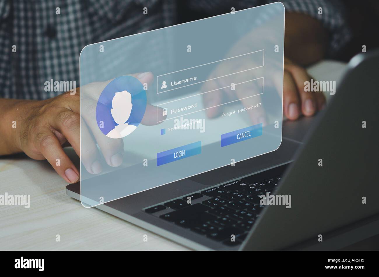 man using laptop computer and sign up or log in username password virtual touch screen. Stock Photo