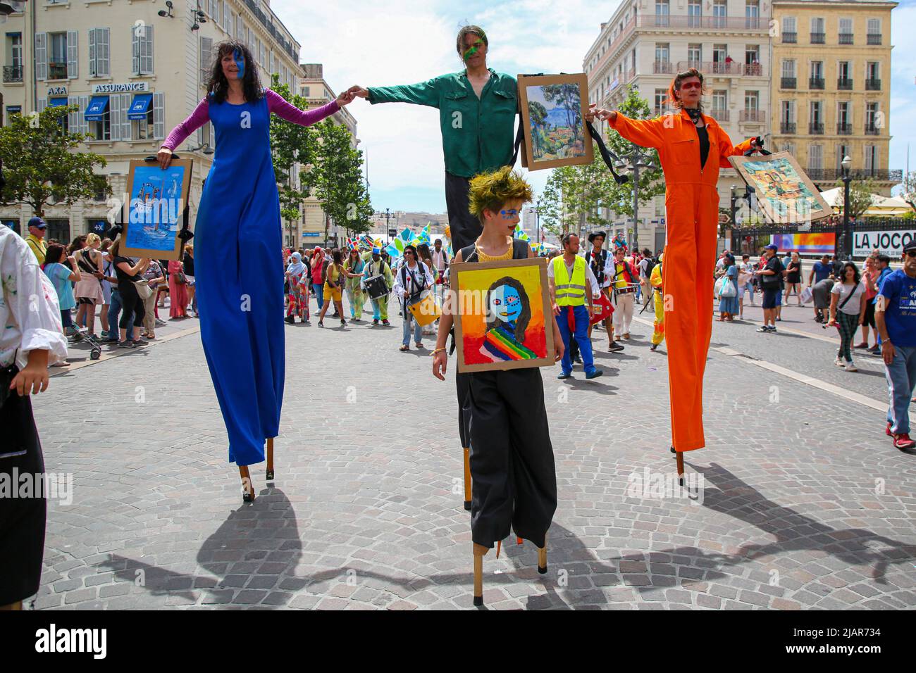 Marseille, France. 28th May, 2022. Carnivalgoers mounted on stilts