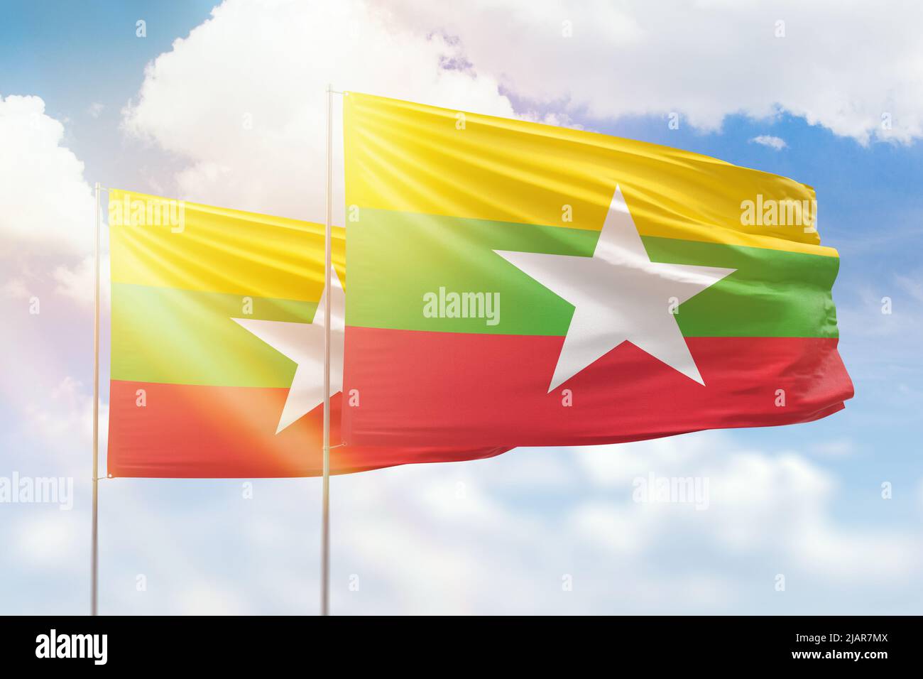 Sunny blue sky and flags of myanmar and myanmar Stock Photo - Alamy
