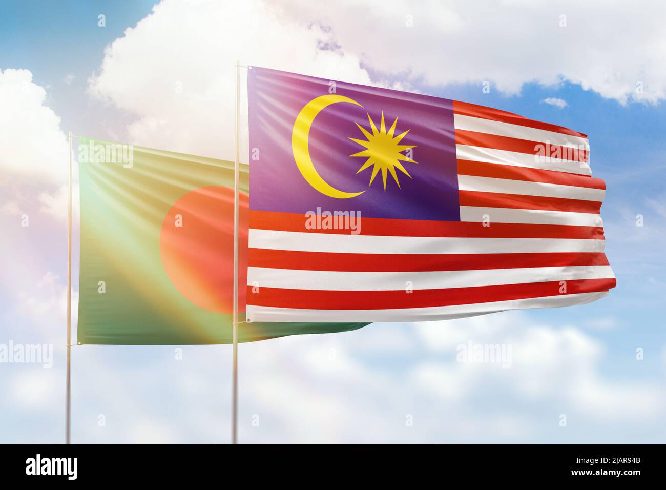 Sunny blue sky and flags of malaysia and bangladesh Stock Photo - Alamy