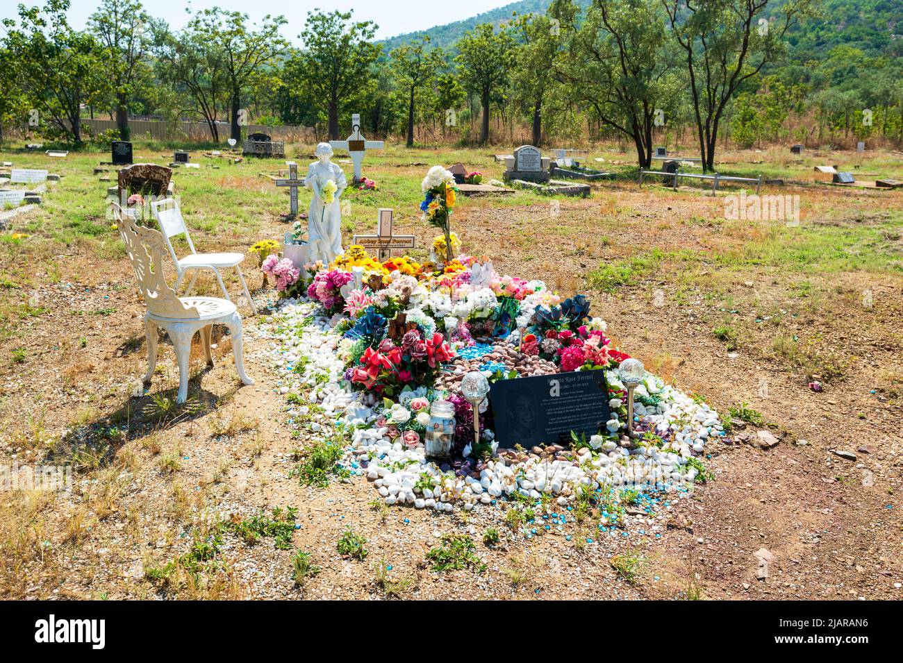 A highly decorated grave in the historic Gully Cemetery, Wyndham, Western Australia, WA, Australia Stock Photo