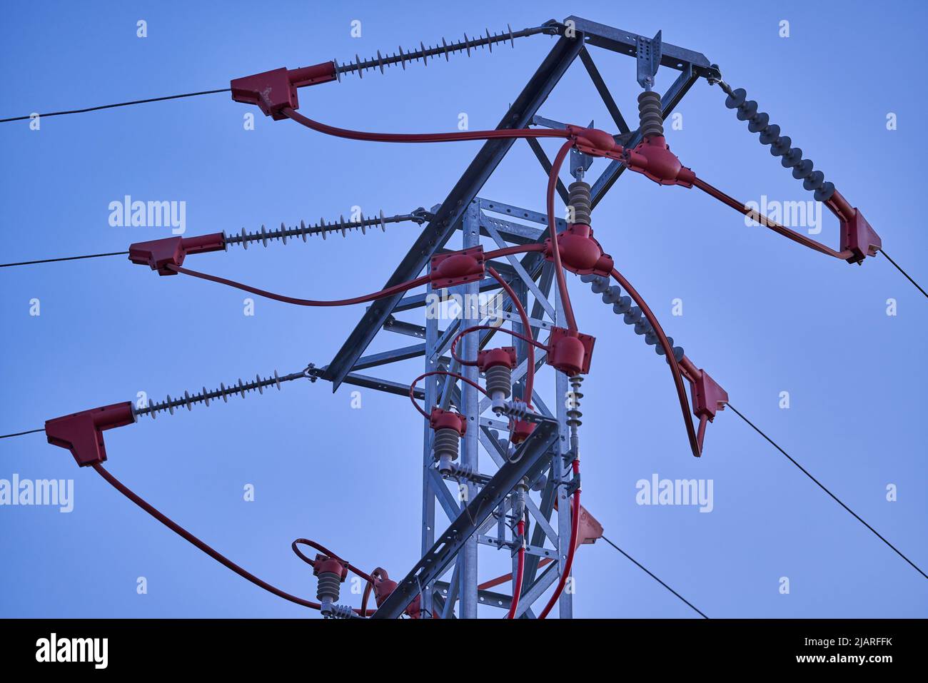 Pole with the connection of high voltage electrical cables Stock Photo