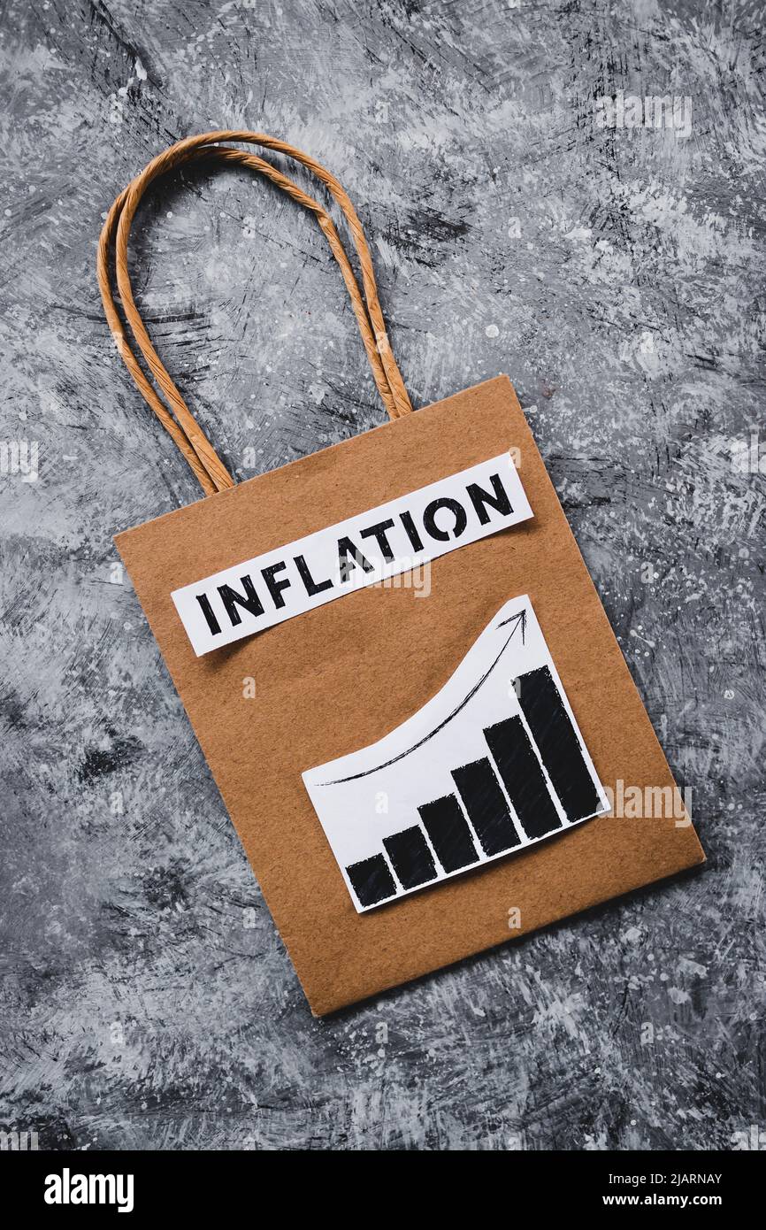 inflation and stagnating economy conceptual image with text over