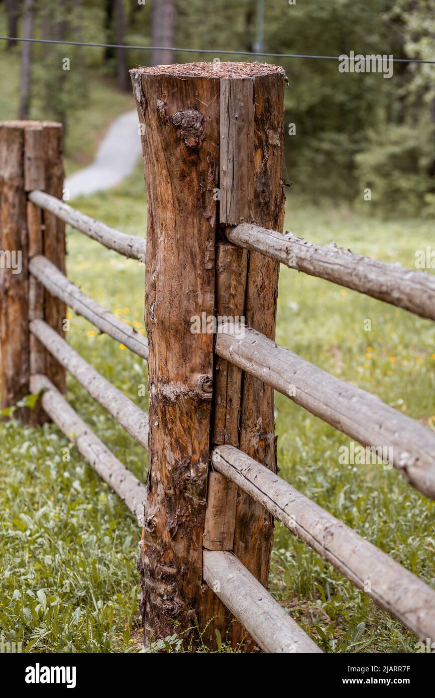 Old Wooden Log Barn Surrounded By A Fence Stock Photo, Picture and Royalty  Free Image. Image 19959936.