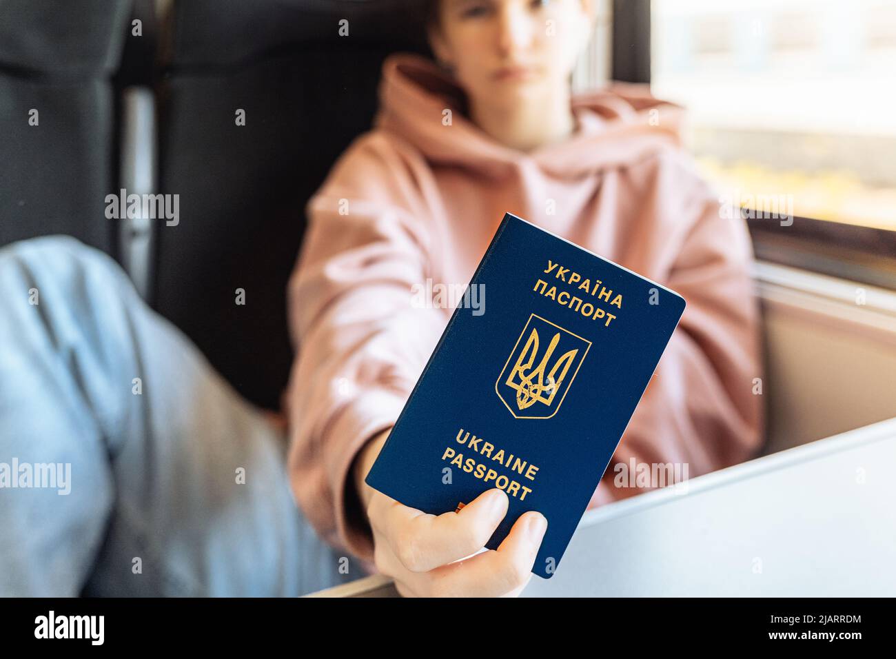 Presentation of biometric passport of identity card of citizen of Ukraine in transport, train. Free travel for temporarily resettled residents Stock Photo