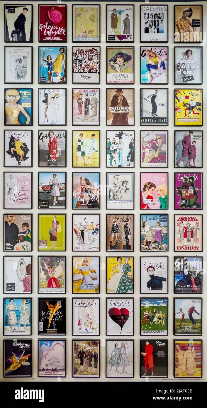 Paris, France - April 6, 2022: Various magazine cover poster of Galleria la Fayette. Many different colorful fashion covers advertising famous mall Stock Photo