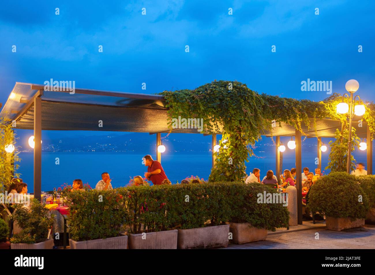 Promenade and restaurant on the shore of Lake Maggiore, Cannero Riviera, Piedmont, Italy, Europe Stock Photo