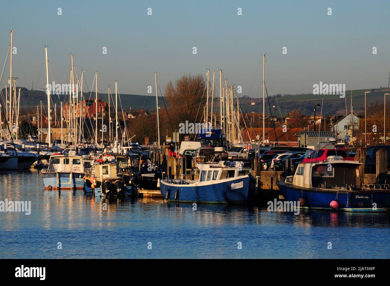 small boats moored in Weymouth marina in winter. Stock Photo