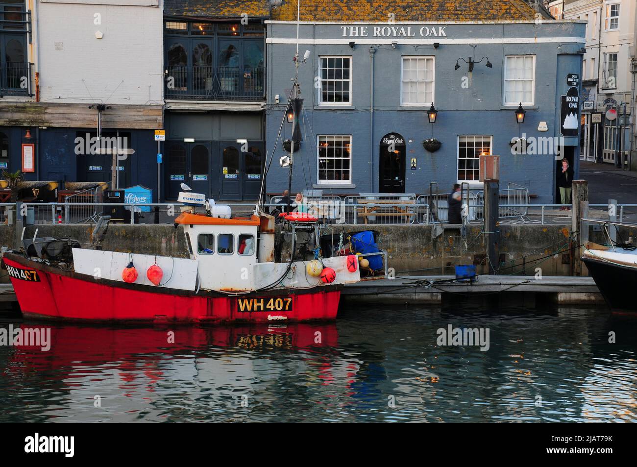 Small fishing boat moored in Weymouth harbour, Dorset Stock Photo