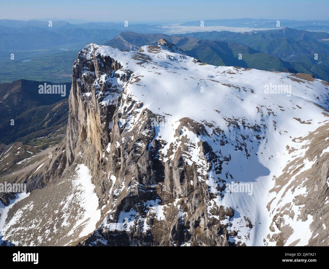 AERIAL VIEW. Pic de Bure viewed from the north, with its snow spring. France. Stock Photo