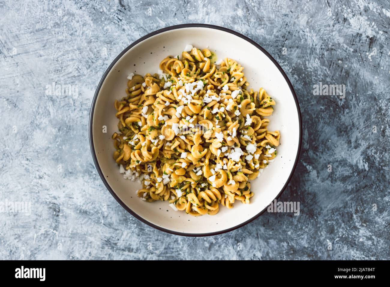 vegan spinach and dairyfree ricotta pasta bowl with wholemeal spirals