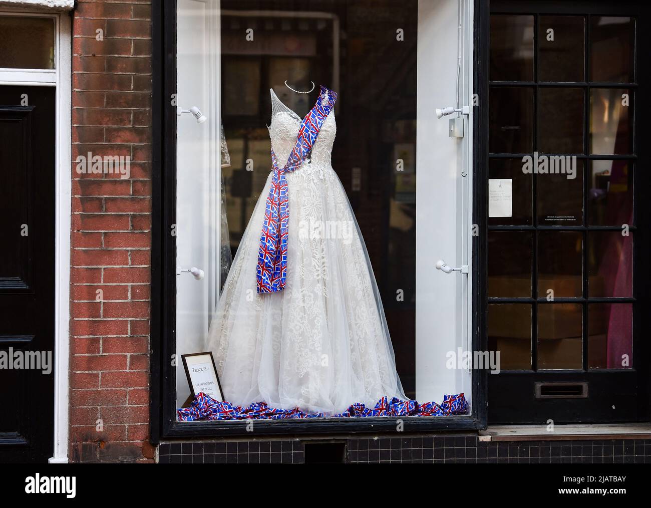 Brighton UK 1st June 2022 - Shops in Rottingdean village near Brighton are ready for the Queen's Platinum Jubilee Celebrations over the next few days : Credit Simon Dack / Alamy Live News Stock Photo