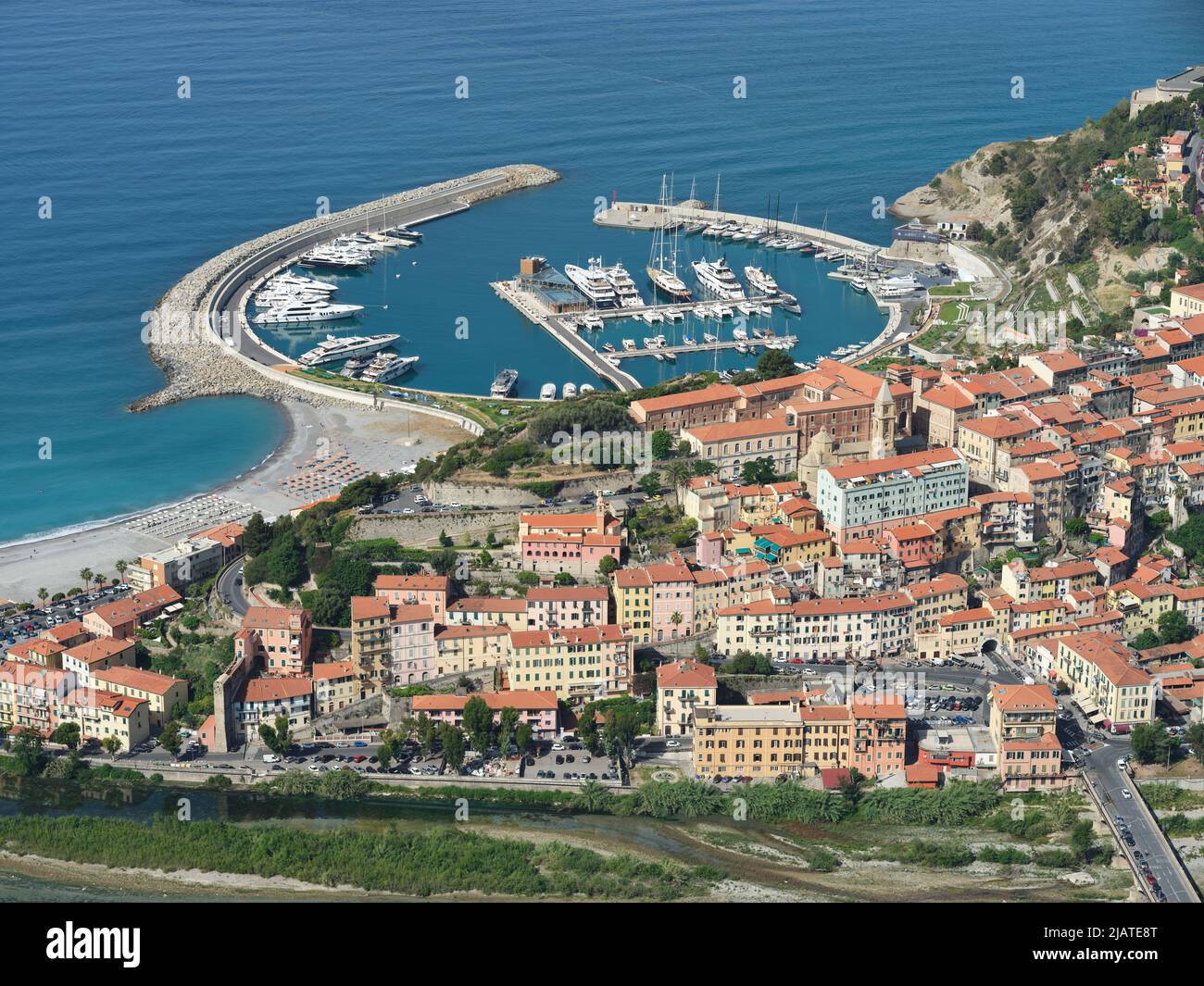 AERIAL VIEW. The medieval town of Alta Ventimiglia and the new (inaugurated in 2021) marina with its superyachts. Ventimiglia, Liguria, Italy. Stock Photo